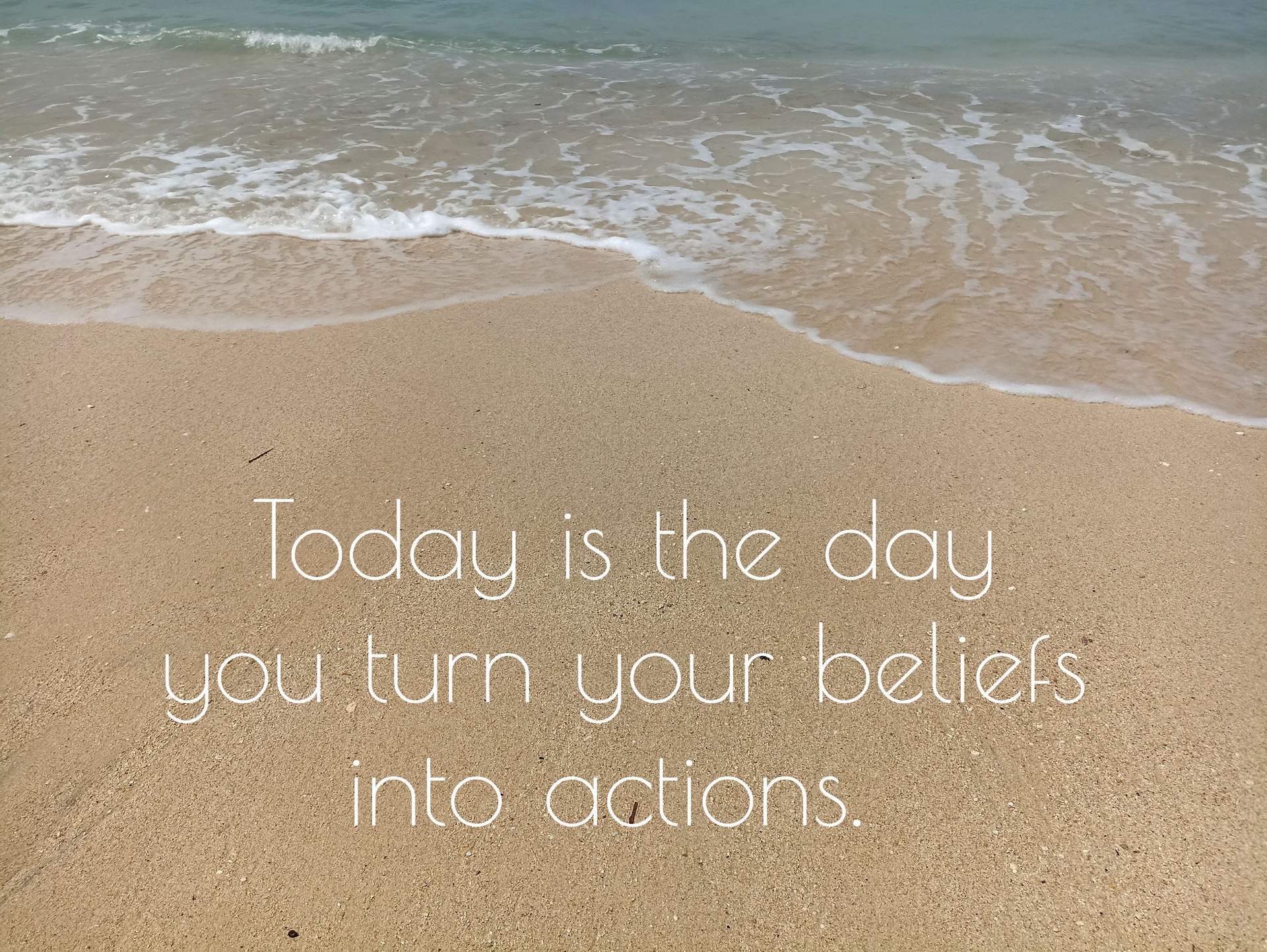 Positive message on the sand - Today is the day you turn your beliefs into actions.